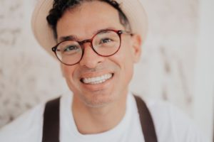 a portrait photo of a smiling man YKG4MEL