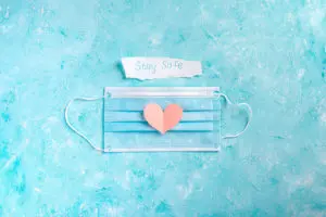 facial mask with a sign stay safe and cut out pink X2VQLHV